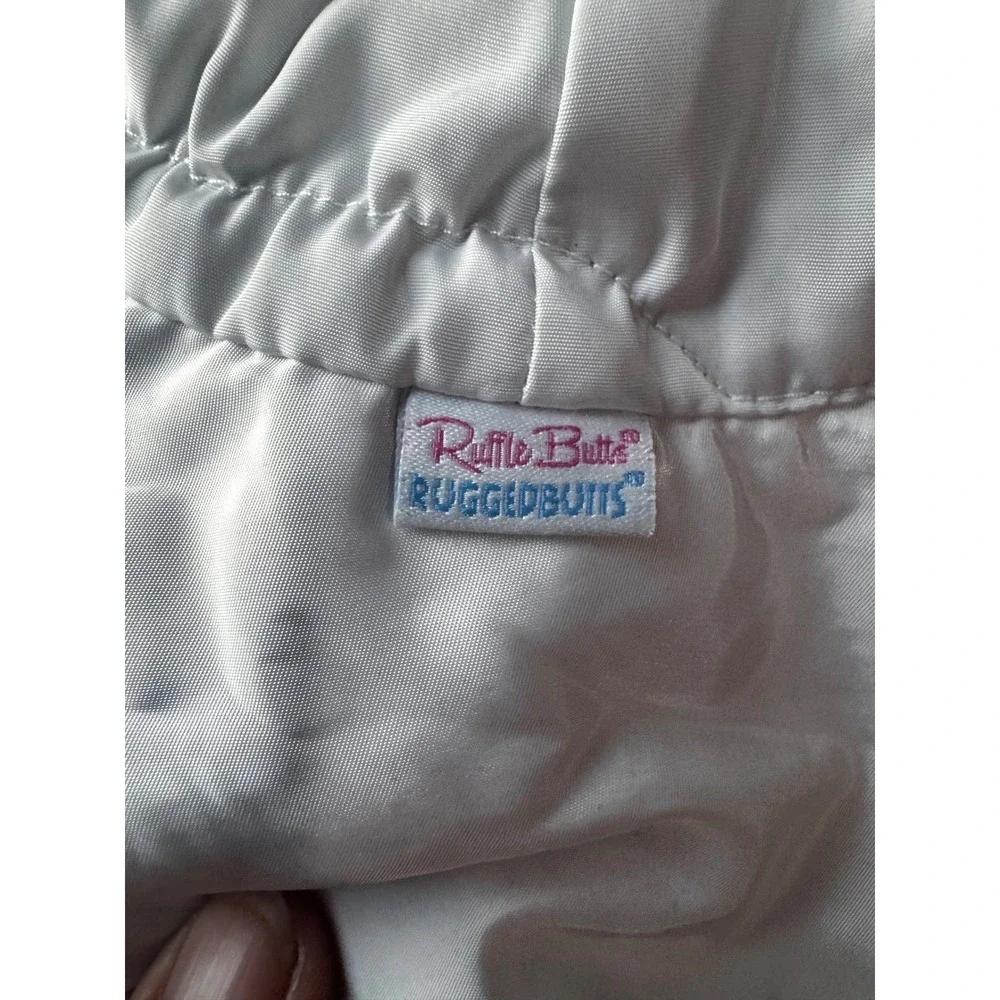 RuffleButts White Baby Sun Hat Wide Brim Chin Ties 6-12m UPF Protection